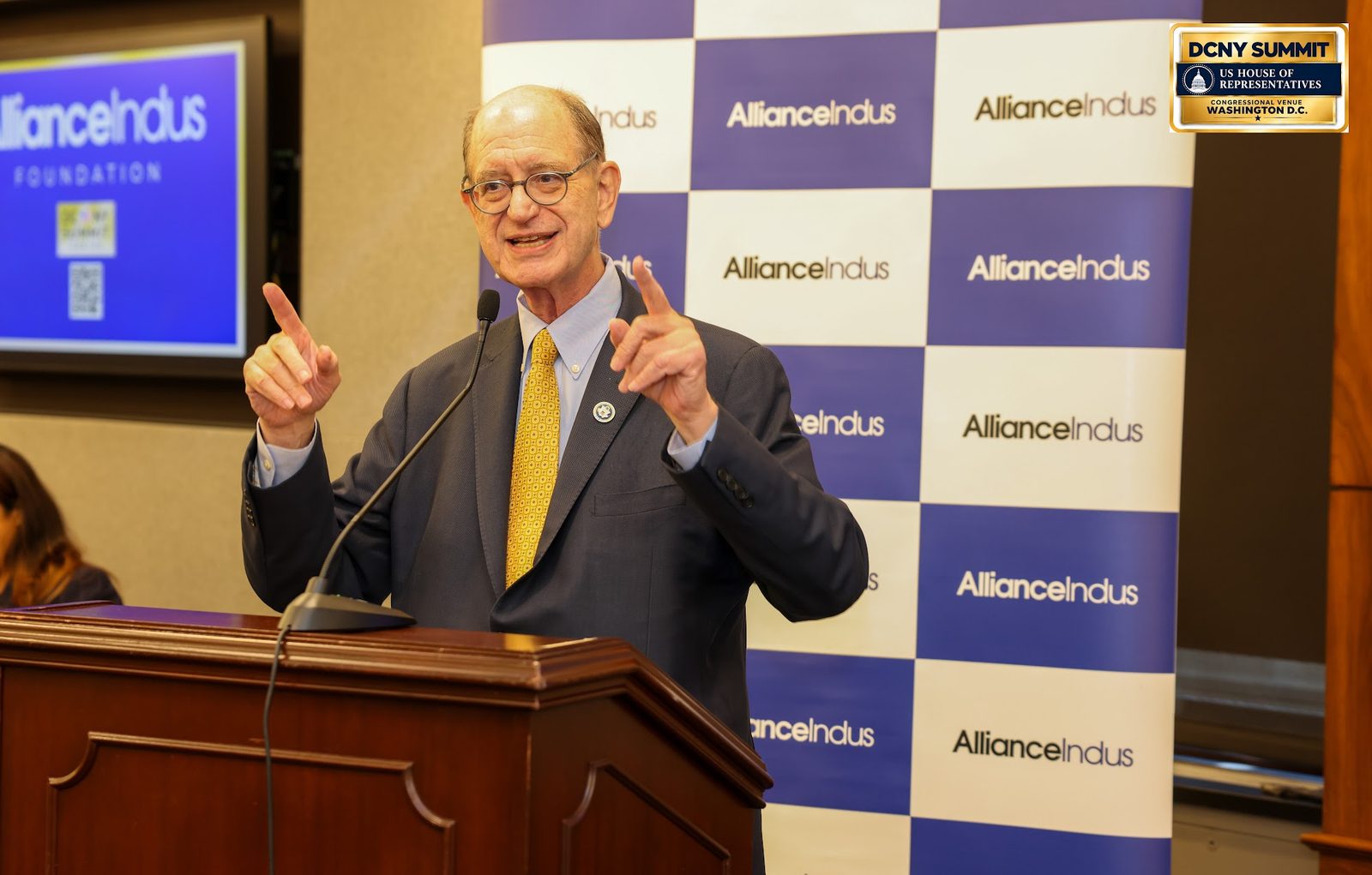 Rep. Brad Sherman gestures with both hands at the podium
